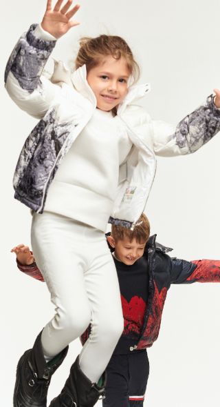 MAX VON TREU photographs for INSTYLE GERMANY with model and jewelry designer Dari Maximova and her two sweet children in the latest ski fashion at a studio in Berlin