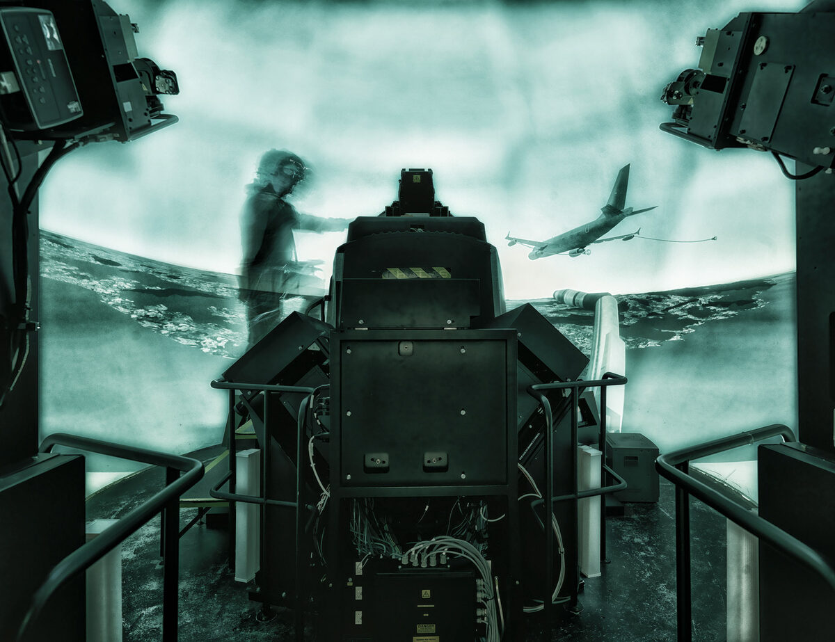 <b>Wolfram SCHROLL</b> rides the flight simulator armed and ready for AIRBUS DEFENCE &amp; SPACE