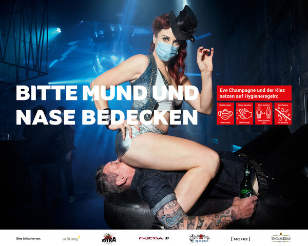 ‘Please cover mouth and nose – the <b>St. Pauli hygiene rules</b>’ – Hamburg’s most provocative poster on the Reeperbahn, photographed by <b>PHILIPP RATHMER</b> for advertising agency Achtung