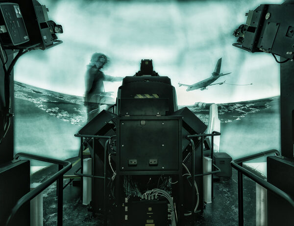 <b>Wolfram SCHROLL</b> rides the flight simulator armed and ready for AIRBUS DEFENCE &amp; SPACE